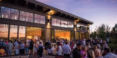 "Company cocktail reception with indoor and outdoor areas for evening networking and fun."