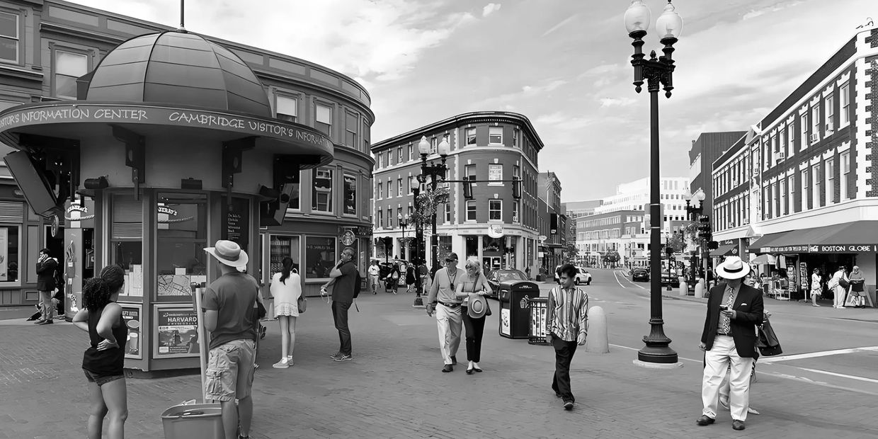 People gather around the Cambridge Visitor's Information Center on a sunny day.