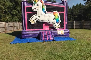 Unicorn bounce house. 15x15 with basketball hoop. Add a banner to the front to customize your bounce house. 