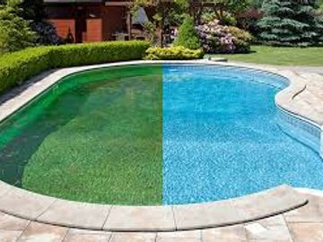 Half of the pool water is clean and blue, the other half is green and dirty.