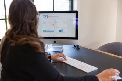 sitting at desk working on a computer