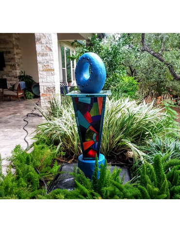 Fountain of mosaic stained glass on polycarbonate with concrete base and concrete over Styrofoam "do