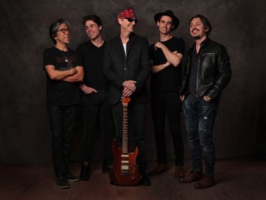The band BoDeans smiling.