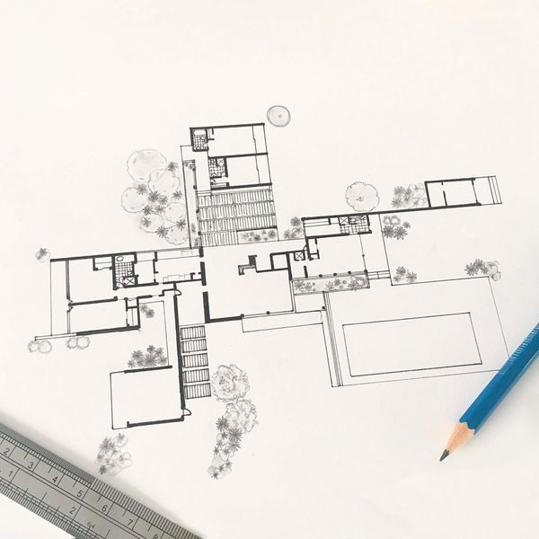 Architectural floor plan drawing with pencil and ruler on white paper.