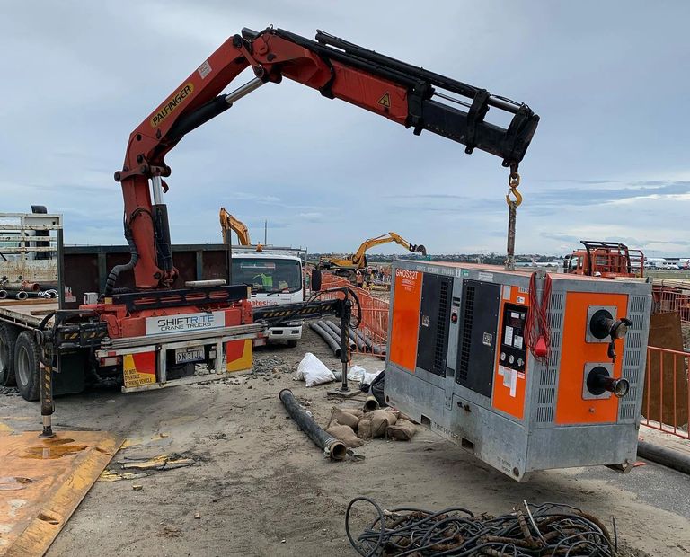 Shiftrite crane trucks Delivering a de-watering pump for Ward Civil for Sydney airport upgrade.