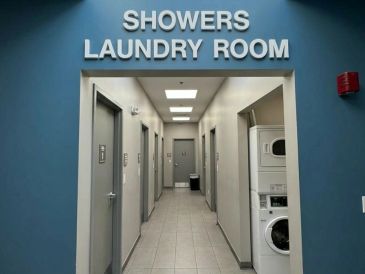 Hallway with showers and laundry room.