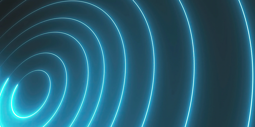 Glowing blue concentric rings on a dark background.
