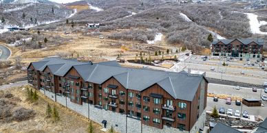 A large lodge-style building in a snowy mountain resort area.