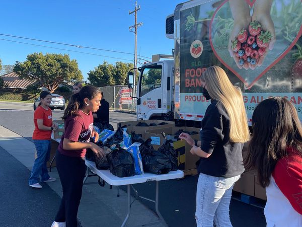 Volunteers distribute food