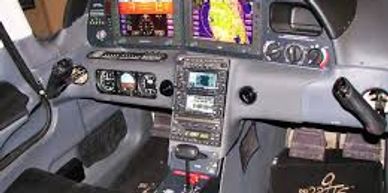 Cockpit of a modern small aircraft with digital displays and controls.