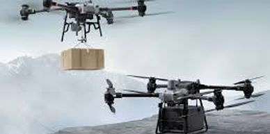 Two drones flying over a mountainous area, one carrying a package.