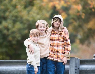 Photo of 3 boys during a lifestyle family session with capturedbyceleste.com at Steele Creek Park. 