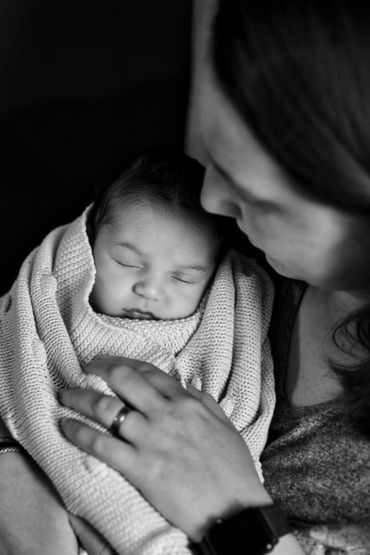 A photo of a mother holding her newborn. 