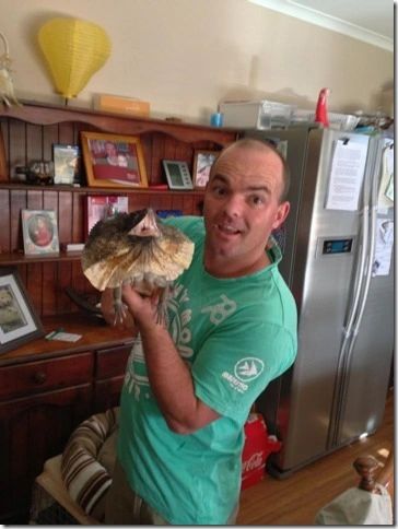 Jamie holds a lizard from his collection.