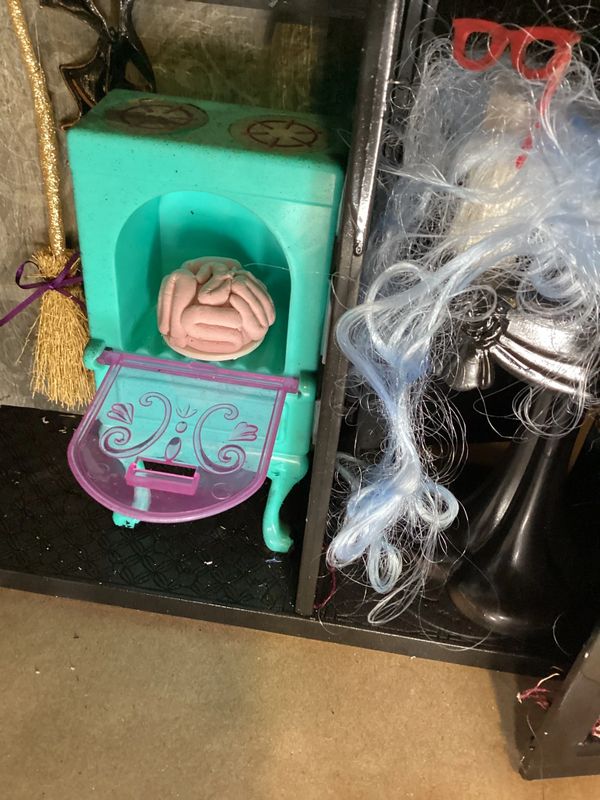 Brains made of clay inside a haunted dollhouse oven hand made by a Queen
