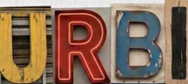 Letters arranged to spell 'ICENT' using different styles and materials.