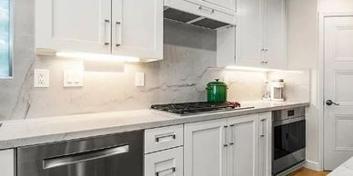 Open-concept kitchen remodel with custom cabinetry and large island