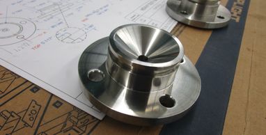 Custom part machined from type 316L Stainless with material certs., polished to a sanitary finish.