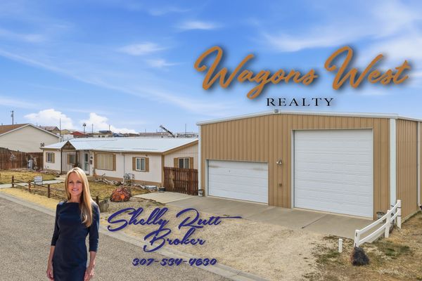 Real estate ad featuring Shelly Puett and a large garage building.