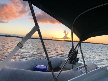 Sunset view from a boat on the water.