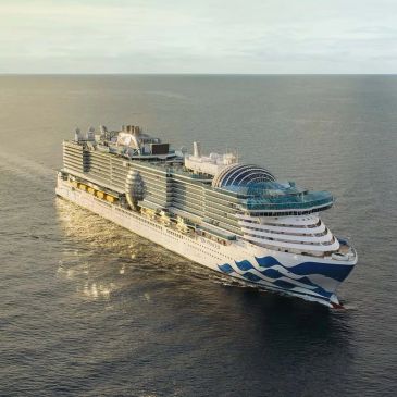 Large cruise ship sailing on calm sea.