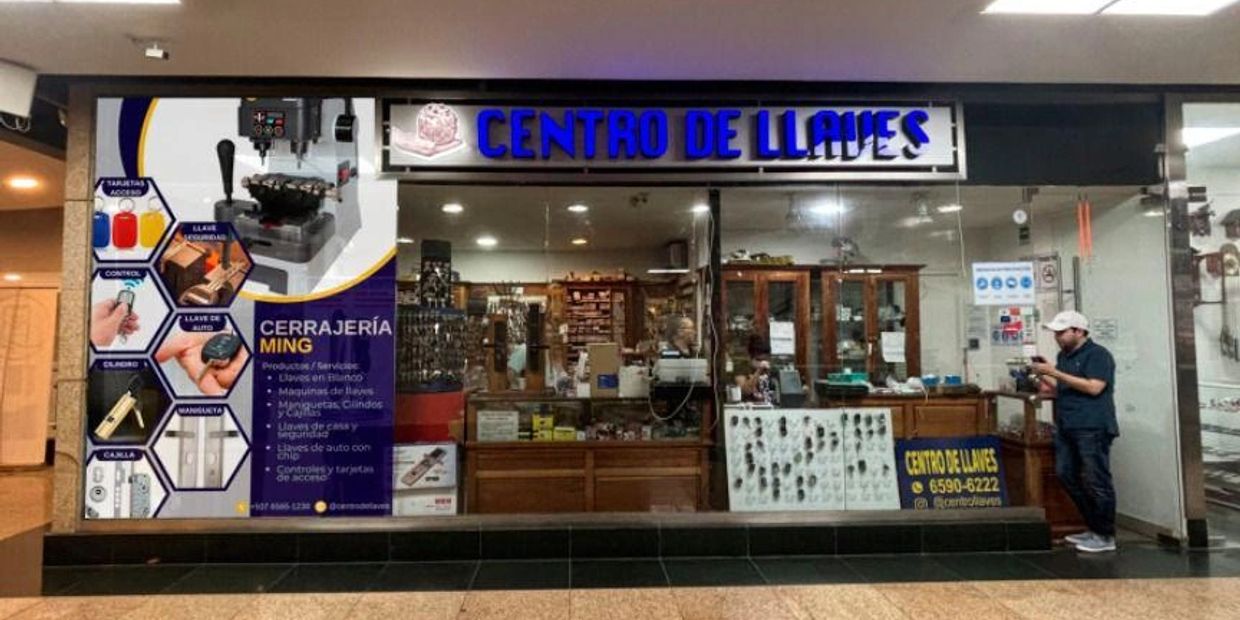 Storefront of Centro de Llaves locksmith shop with various key-related services and products.