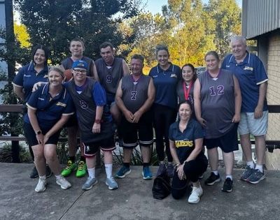 Yarrawonga Mulwala Basketball Association All Abilities team standing at a stadium