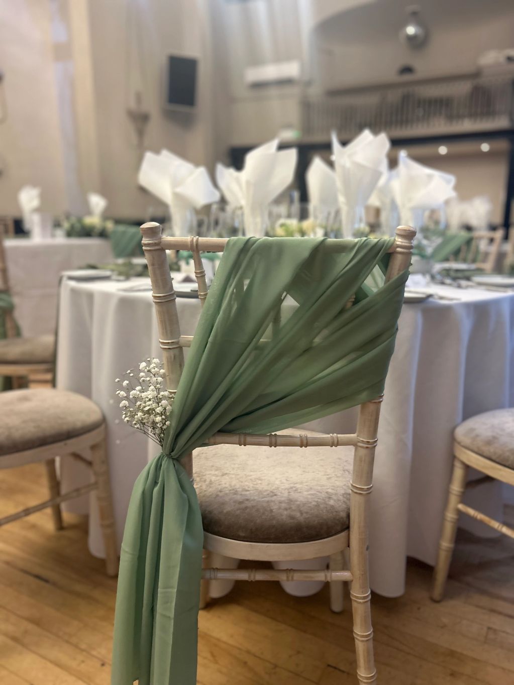 Sage Green Chiffon Drapes. Positioned diagonally with a sprig of fresh gyp. Romantic and floaty. Bea