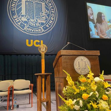 UC Irvine graduation mace in holder at 2021 graduation ceremony. Mace designed by Brian R. Pellar
