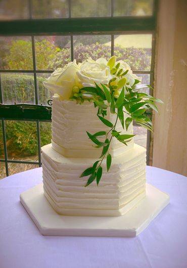 Hexagon buttercream wedding cake, with fresh flowers 
