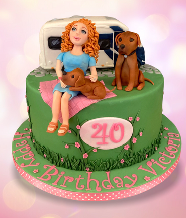 Fondant 40th birthday cake with models of girl, dogs, motor home
