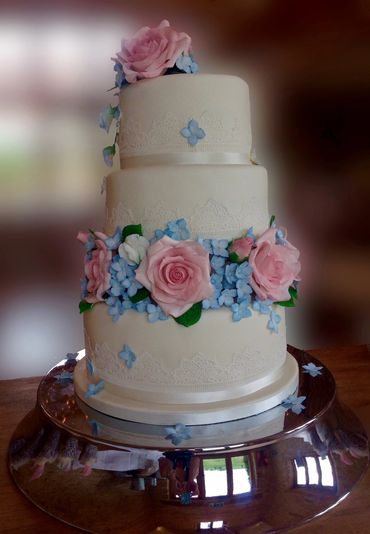 Fondant wedding cake with sugarpaste roses and hydrangeas 