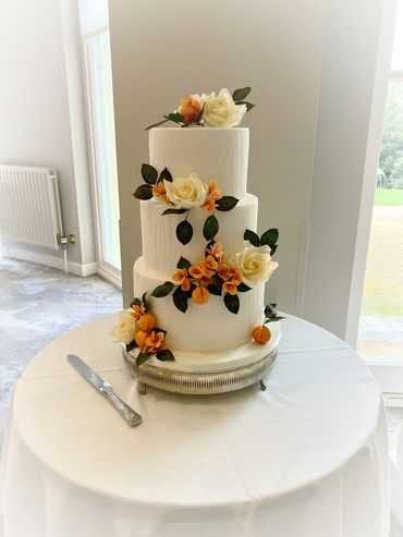 3 tiered fondant wedding cake with sugar flowers