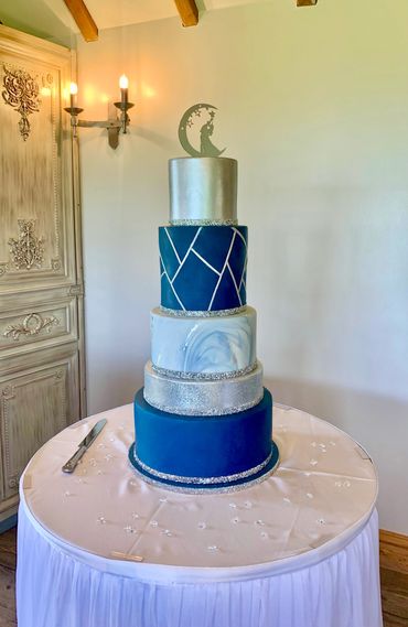 Navy and silver 5 tiered fondant wedding  cake with glitter ribbon