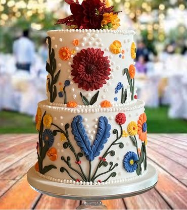 2 tiered colourful wedding cake, fondant with abundance of fondant flowers 