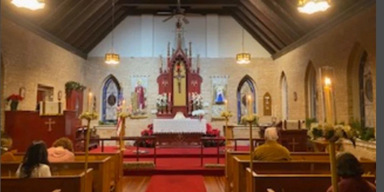 Interior of a church with pews and altar.