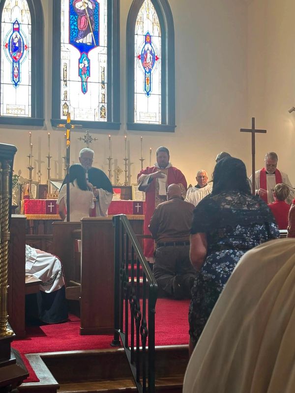 People participating in a church service near the altar.