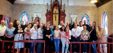 Church congregation posing inside the chapel.