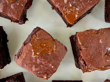 Delicious chocolate brownies with caramel drizzle on top.