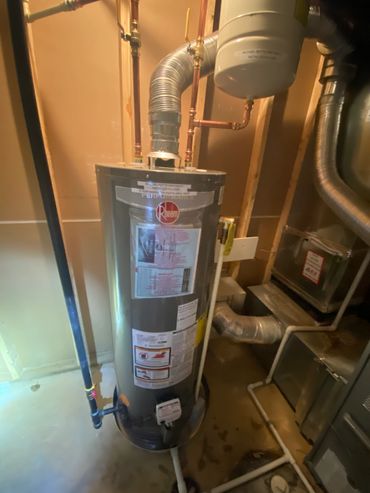 installed new 50 gallon natural gas standard vent water heater complete with drain pan and expansion