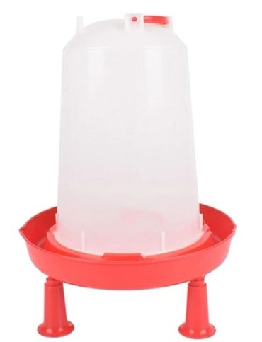 A red and white plastic poultry waterer with three legs.