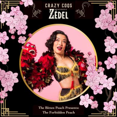 Performing artist in vibrant costume surrounded by cherry blossoms.