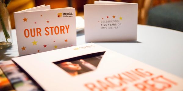 Photo showing three brochures on a table