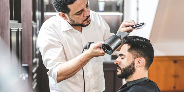 Precise modern haircut at The British Barbers in Chinatown, best barber for refined grooming