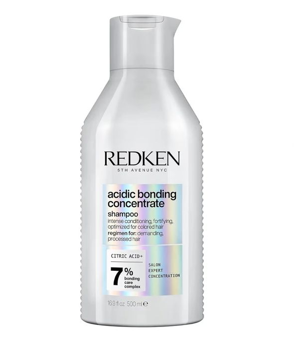 Redken acidic bonding concentrate shampoo bottle.