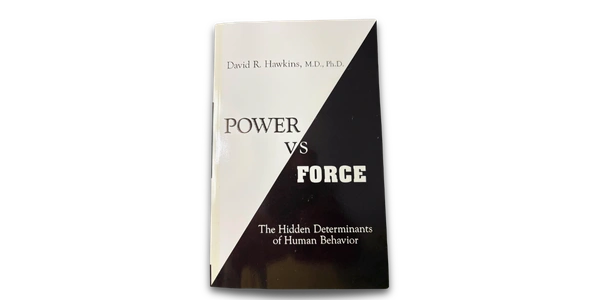 cover of power vs force book, which is divided by solid black and white triangles