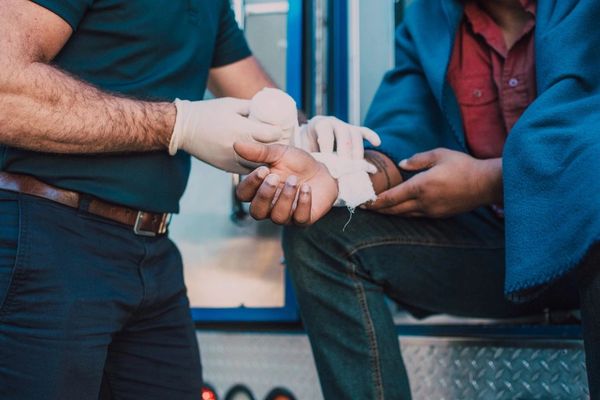 Advanced First Aid Medic Treating an Injured Worker