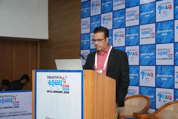 Speaker presenting at Swasthya Con 2026 conference.