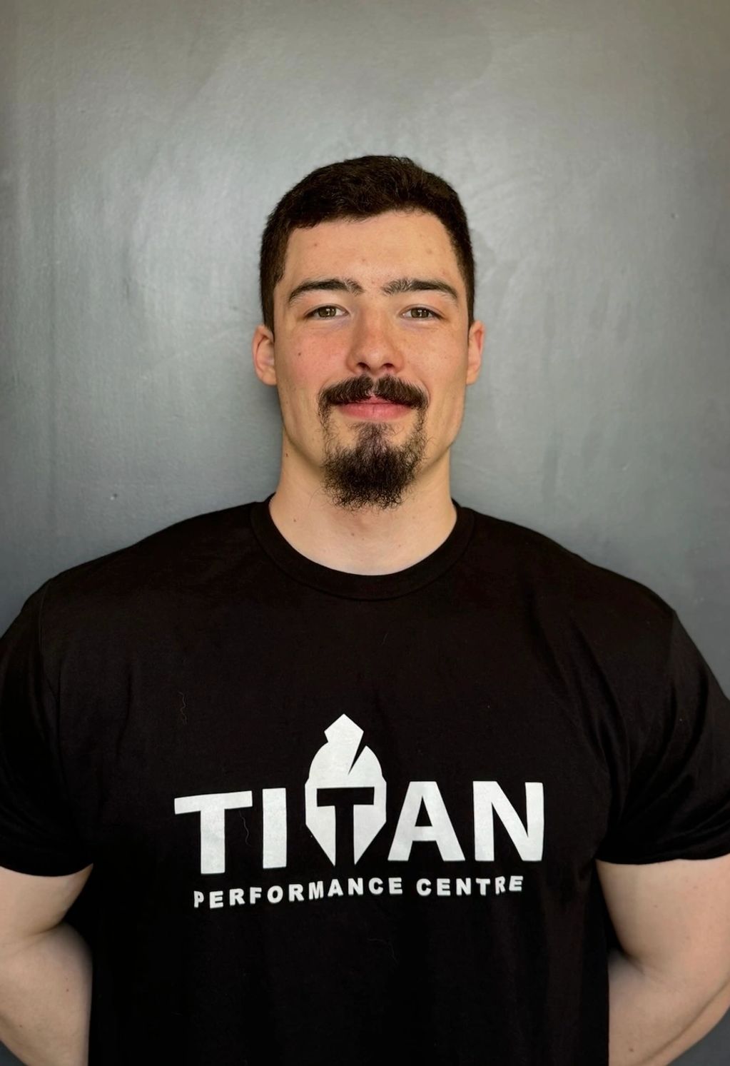 Coach Liam Lively in a black Titan t-shirt