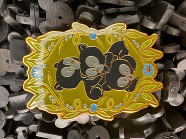 Colorful pin with bear trio design.